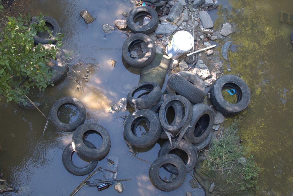 Illegal dumping of tires and various other trash at the intersection of Old Mexia Road and the Tehuacana Creek. Photo by Cameron Castilaw, September 2024.